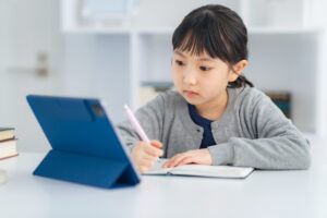 Asian,Little,Girl,Studying,With,A,Tablet,Pc.